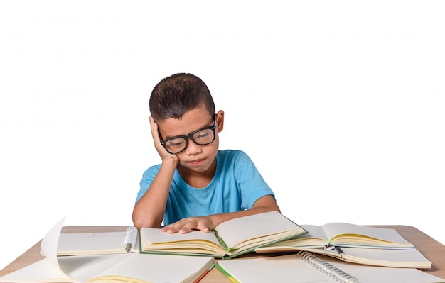 boy with glasses thought and many book on table