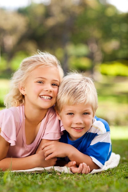 Boy with his sister in the park