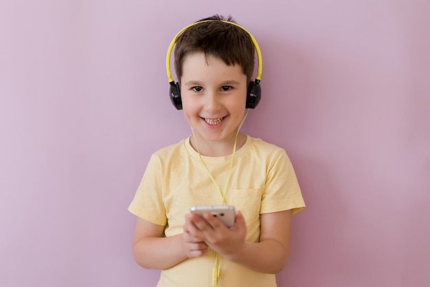 Boy with smartphone in headphones