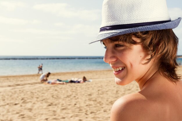 Boy with sun lotion on shoulder