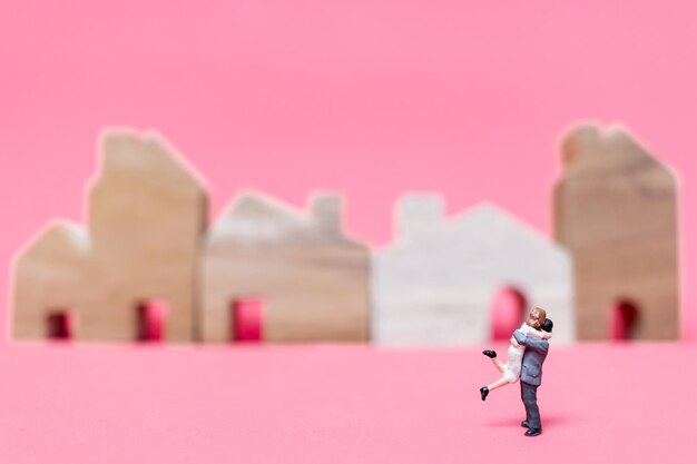 Boy with toy against pink background