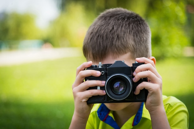 Boy with a vintage camera.