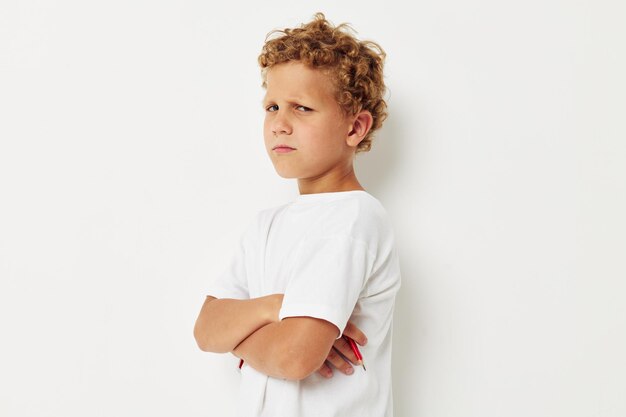 Boy with white hair angry facial expression resentment light background