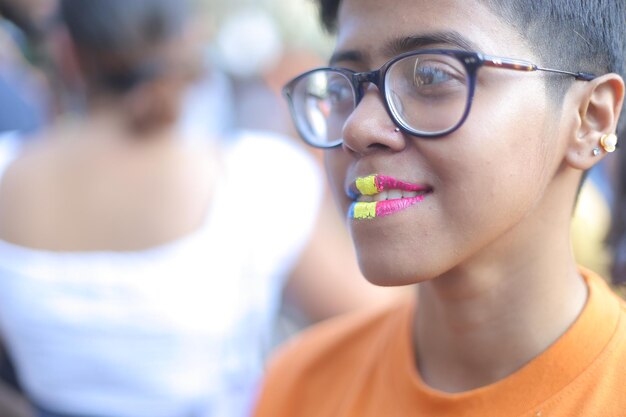 A boy with a yellow sticker on his mouth