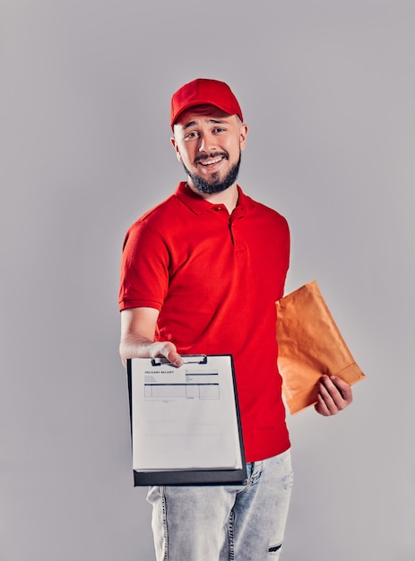 The boy works as a courier. a series of photos about the work
of the courier. on the gray background.