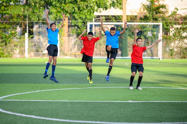 Boys playing football on the football practice field