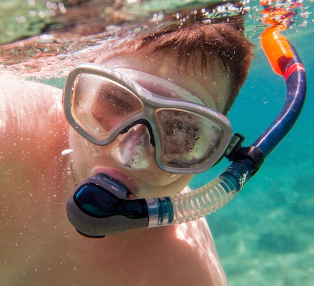 boys in the sea, snorkeling