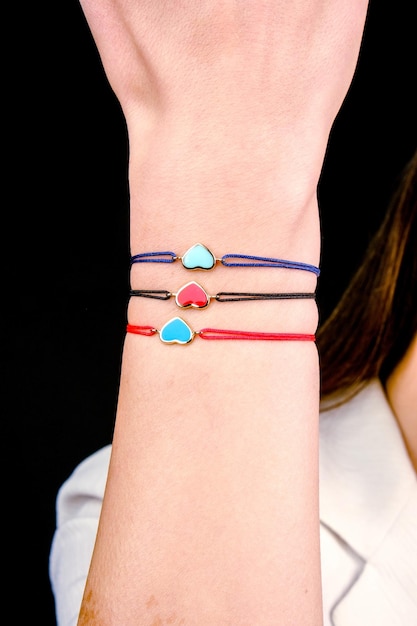 a bracelet with a colorful heart and a colorful bracelet on it