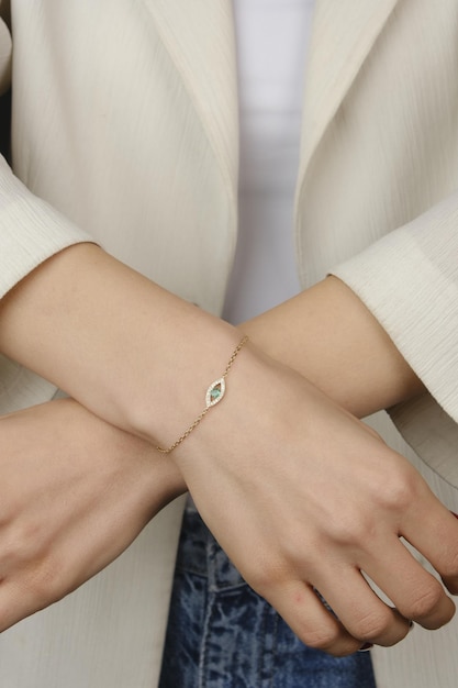 a bracelet with a small white button on the wrist