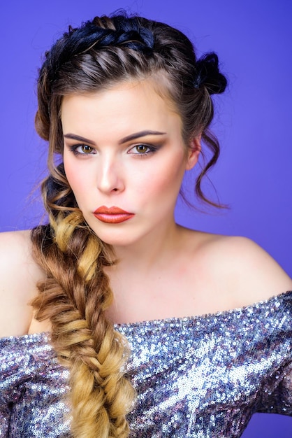 Braided hairstyle Beautiful young woman with modern hairstyle Girl makeup face braided long hair French braid Professional hair care and creating hairstyle Beauty salon hairdresser art