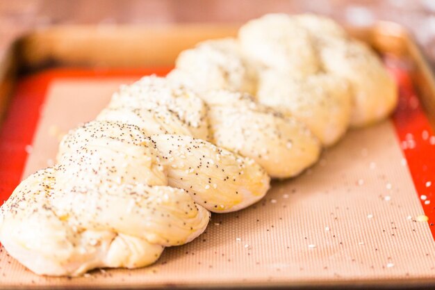 Braiding dough to bake challah bread.