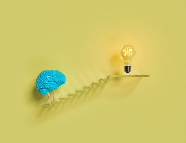 Photo brain climbing stairs to a light bulb