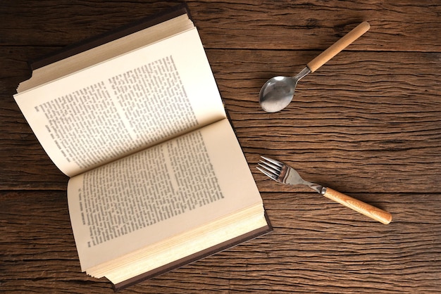 Brain food, books and utensils reflect the brain food concept.