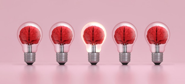 빛나는 전구 안의 뇌는 분홍색 배경에서 군중으로부터 어나옵니다. 영감의 개념