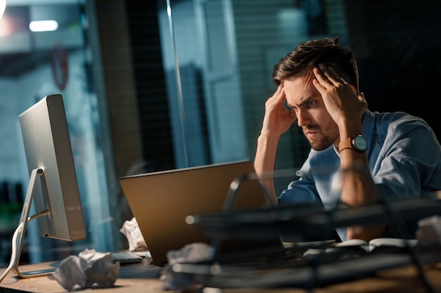 Brainstorming man using laptop