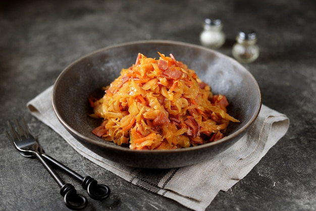 Braised cabbage with ham, onions and carrots