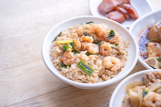 Braised shrimp over rice - Taiwan famous traditional street food. Soy-stewed prawn on cooked rice.