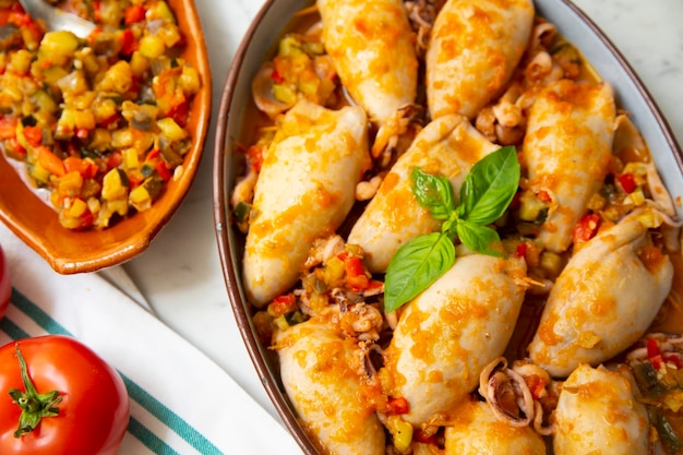 Braised squid stuffed with vegetables and meat. traditional spanish tapa recipe