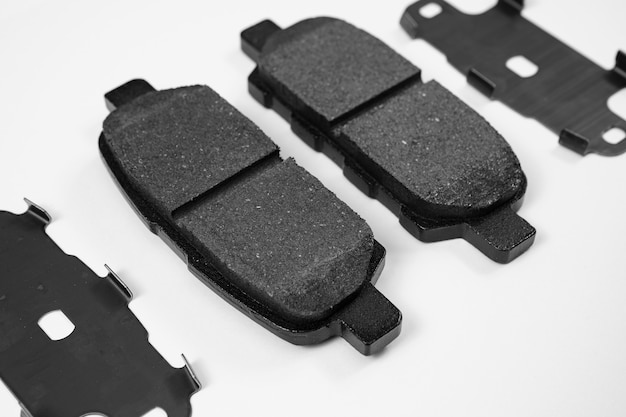 The brake pad against a white background part of the braking system