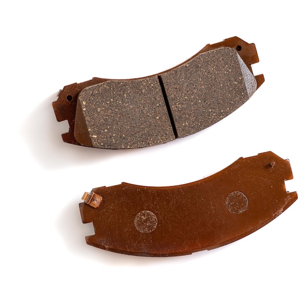 Brake pads for disc brakes of the car on a white background Pads to replace wornout brakes