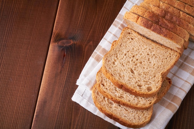Bran bread on brown background
