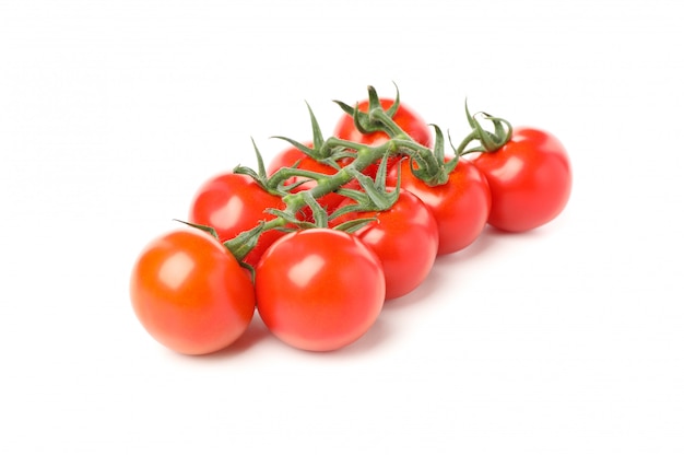 Branch of red tomatoes isolated on white background