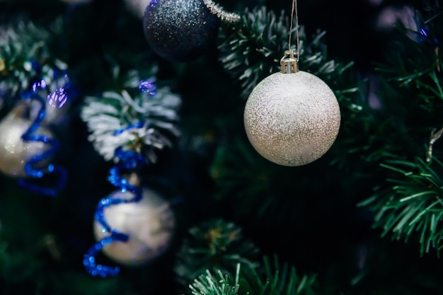 Branches of a Christmas tree decorated with toys for the new year. Christmas background.