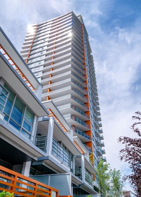 Brand new highrise building on blue and white sky background