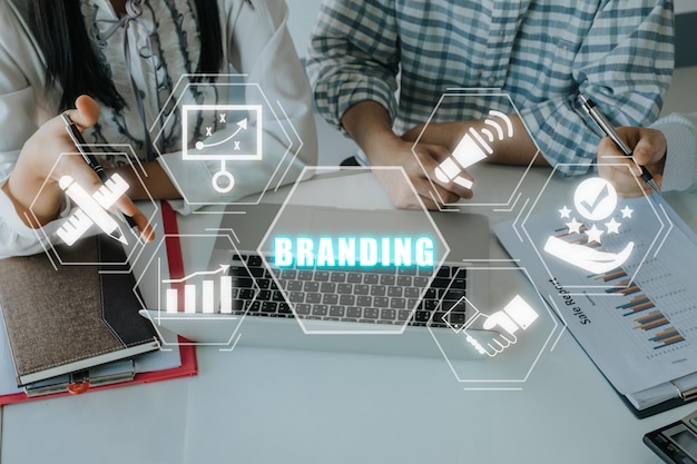 Branding Concept Business team meeting on office desk with branding icon on viirtual screen