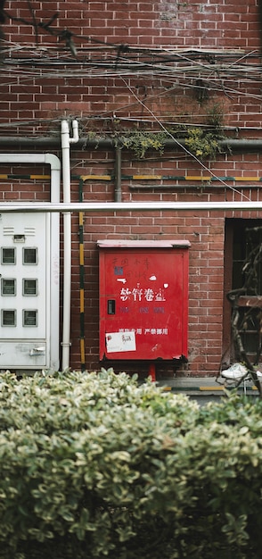 Brandslanghaspel op de muur in Hongkou-District