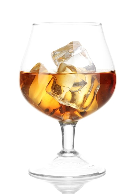 Brandy glass with ice isolated on white