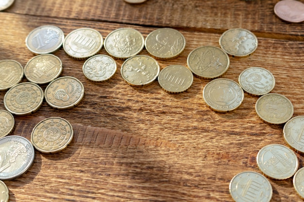 brass coins on the wooden with copy space