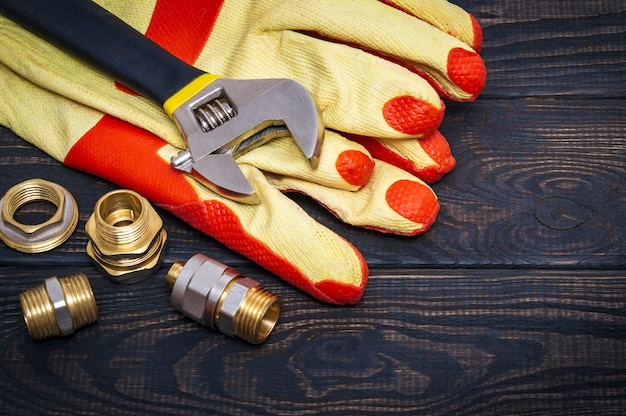 Brass fittings and yellow work gloves