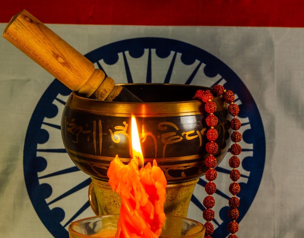 A brass pot with the word mahadev on it