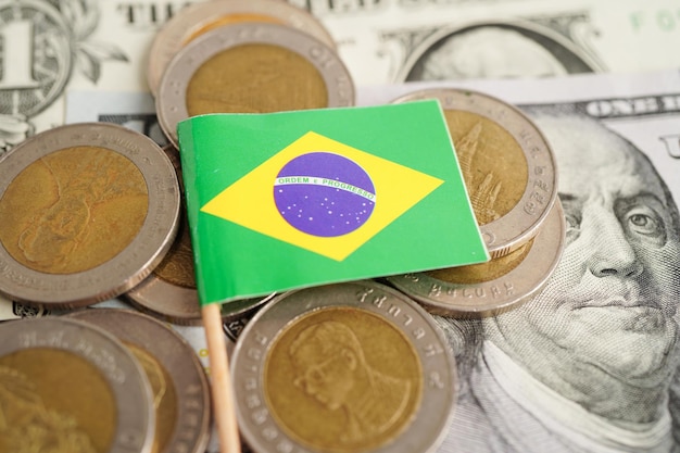 Brazil flag on coins background finance and accounting banking concept