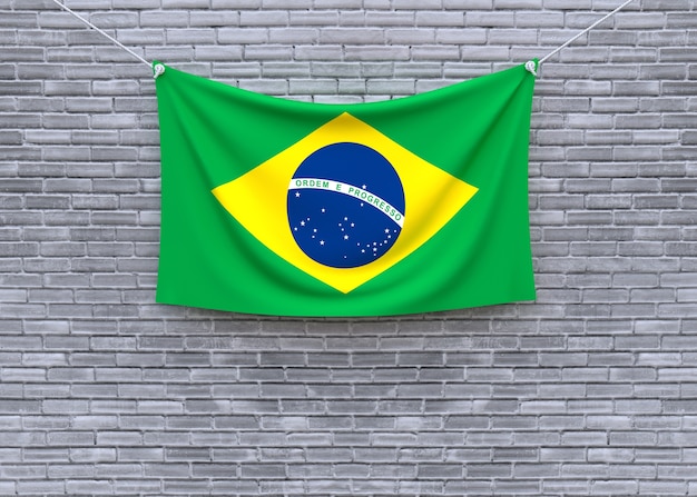 Brazil flag hanging on brick wall