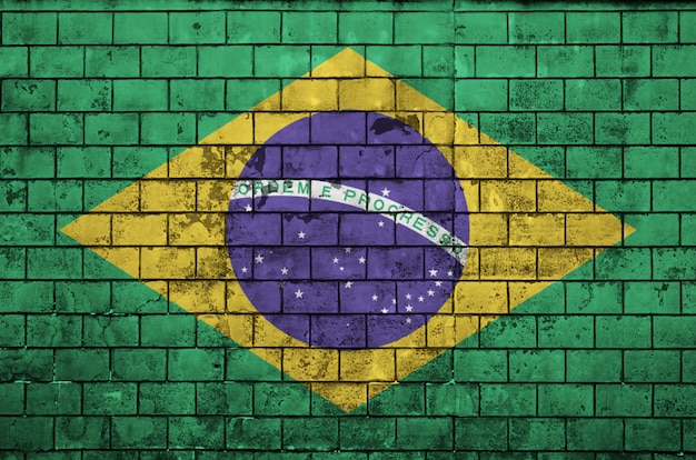 Brazil flag is painted onto an old brick wall