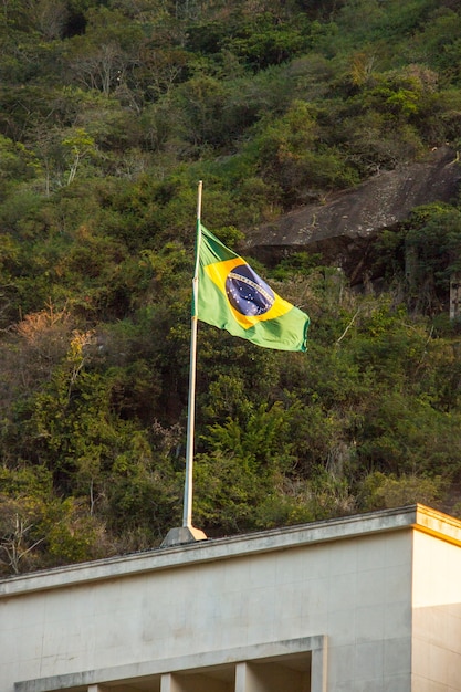 Brazil flag outdoors on top of a building in Rio de Janeiro Brazil.