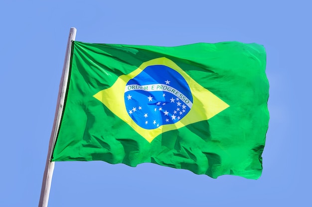 Brazil national flag textile cloth waving on top, blue sky brazil, patriotism concept