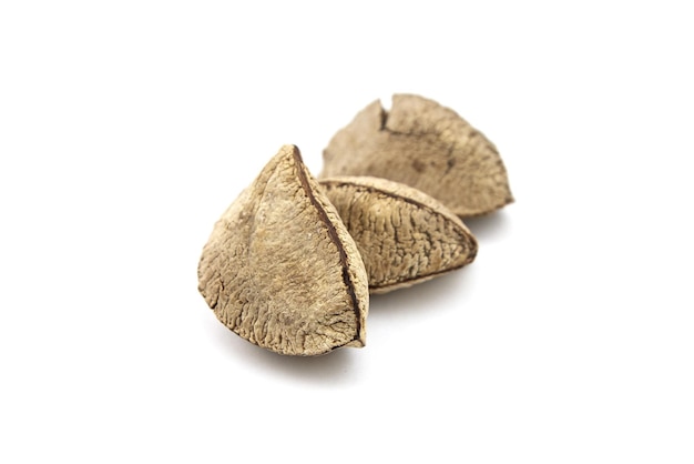 Brazil nuts or Bertholletia excelsa seeds isolated on white background