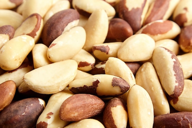 Brazil nuts closeup as background Shelled brazil nuts