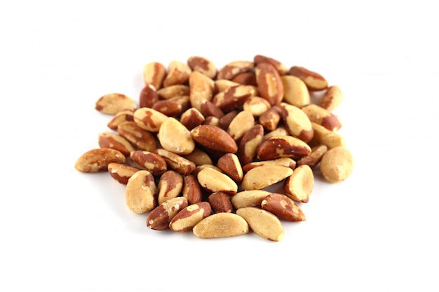 Brazil nuts closeup on a white surface