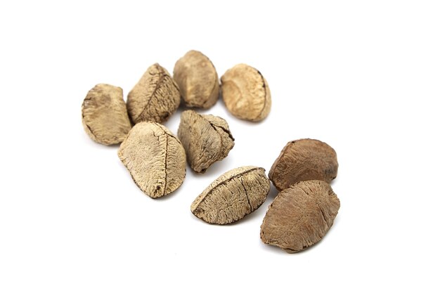 Brazil nuts heap or Bertholletia excelsa seeds isolated on white background