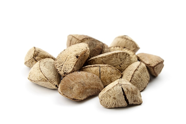 Brazil nuts heap or Bertholletia excelsa seeds isolated on white background