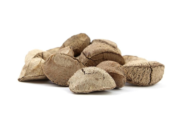 Brazil nuts heap or Bertholletia excelsa seeds isolated on white background