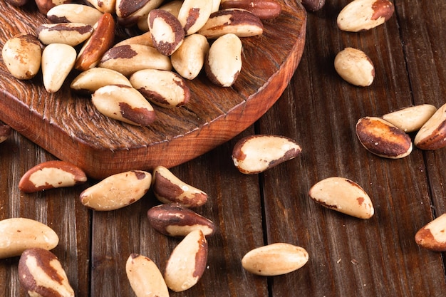 Brazil nuts on wooden background