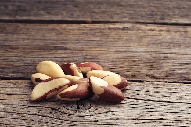 Brazil nuts on wooden background