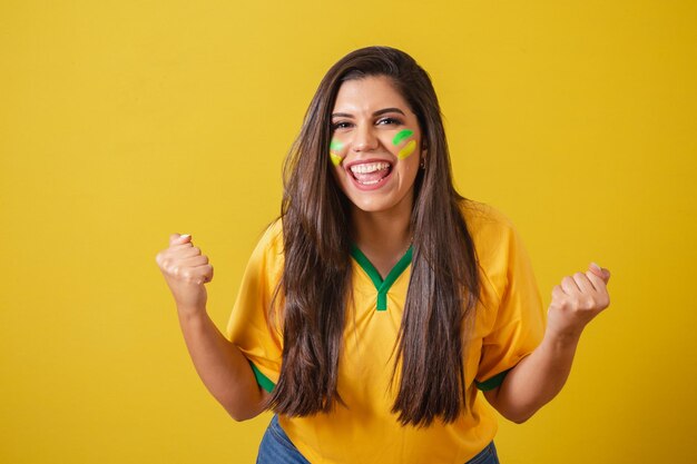 Brazil woman supporter 2022 world cup football championship\
vibrating team victory