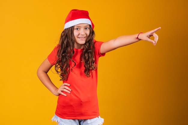 Brazilian afro woman wearing typical clothes for the Festa Junina in yellow background