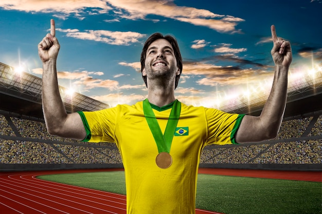 Brazilian Athlete Winning a golden medal on a Track and field stadium.